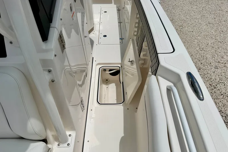 Slide: The Image of 2018 Wellcraft 302 Fisherman boat interior with open storage compartment. - 43