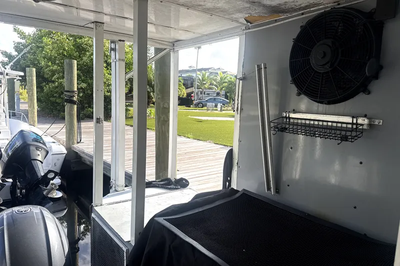 Slide: The Image of Interior view of a 1989 Landau 28 Houseboat with dockside setting. - 21