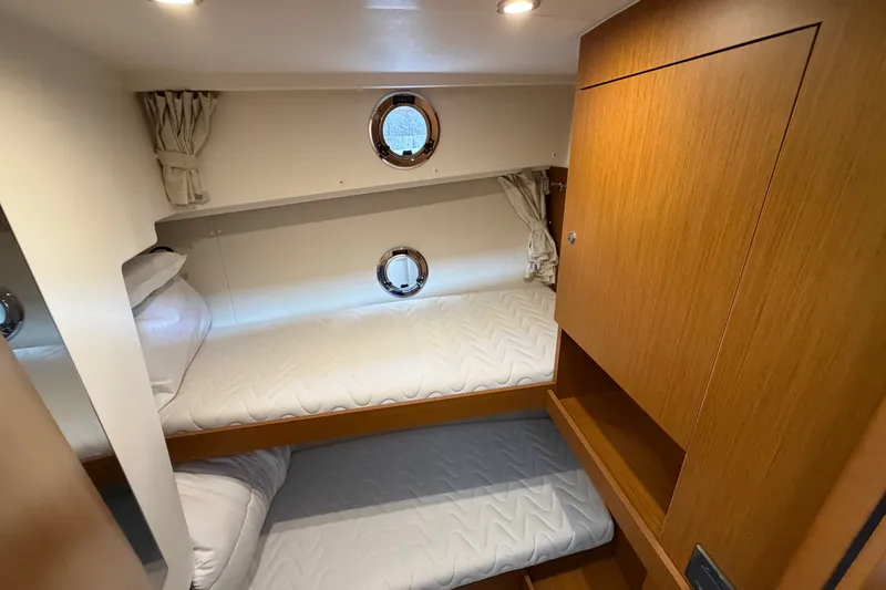 Slide: The Image of Cozy cabin with bunk beds in 2025 Beneteau Swift Trawler 35 yacht. - 31