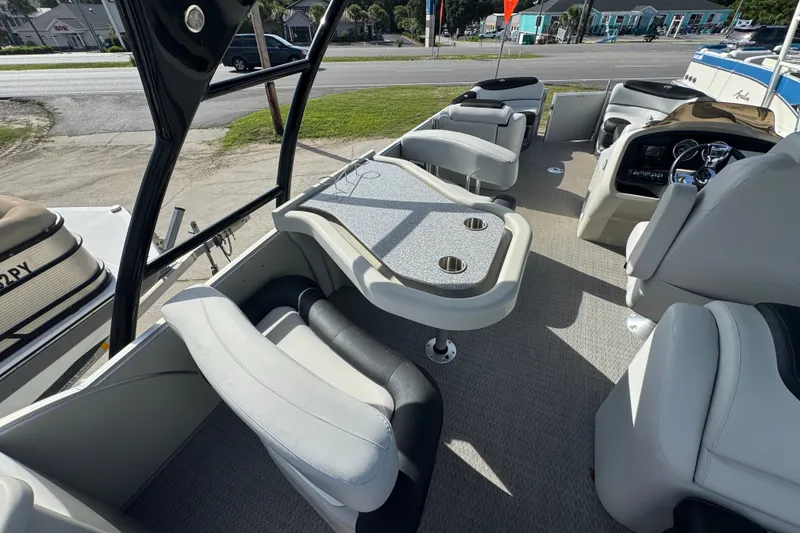 Slide: The Image of 2020 Avalon Catalina Platinum Entertainer boat interior with seating and table setup. - 4