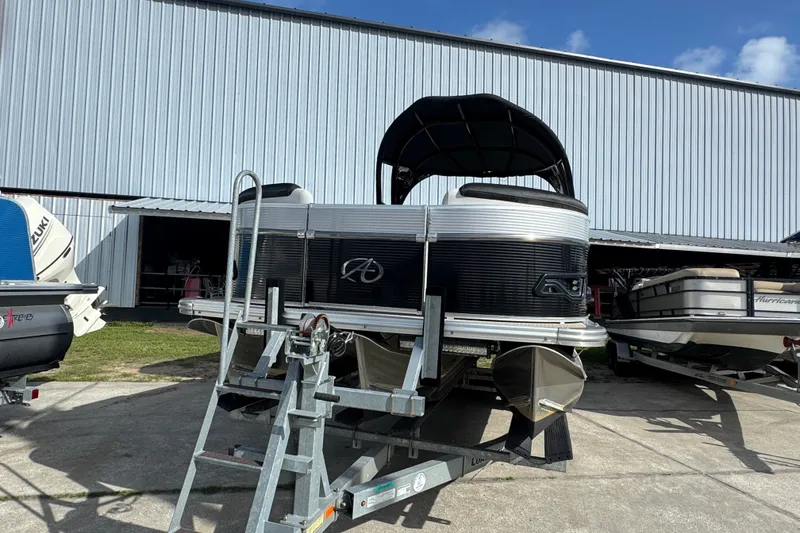 Slide: The Image of 2020 Avalon Catalina Platinum Entertainer pontoon boat on trailer outside storage facility. - 8