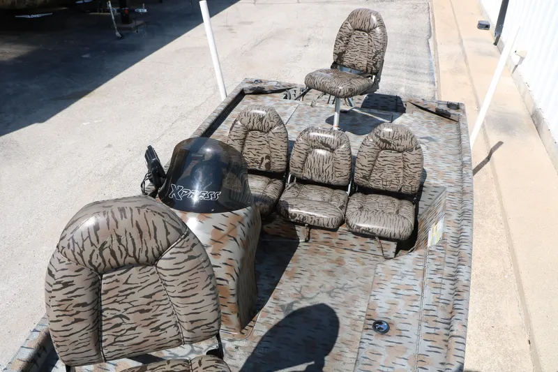Slide: The Image of 2015 Xpress XP170 boat with camouflage seating and steering console. - 21