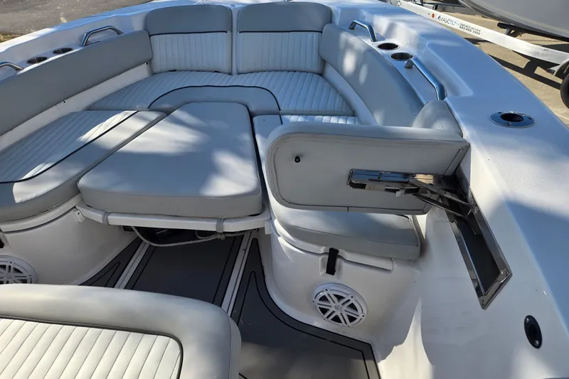 Slide: The Image of 2023 Sea Fox 248 Commander boat interior with gray cushioned seating and cup holders. - 25