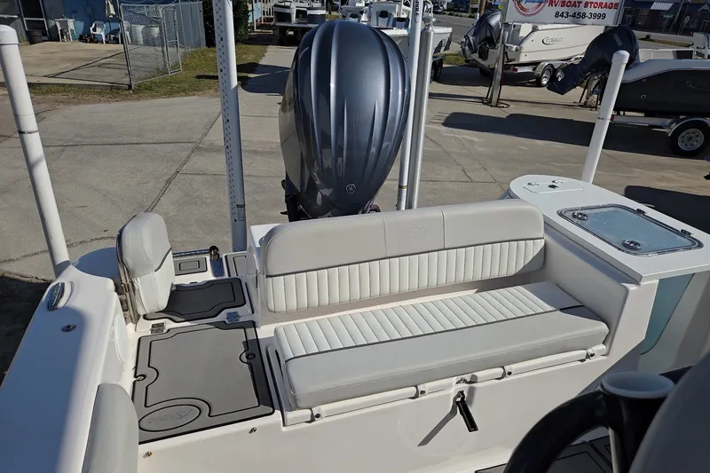 Slide: The Image of 2023 Sea Fox 248 Commander boat interior with seating and engine view. - 23