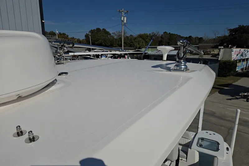 Slide: The Image of 2023 Sea Fox 248 Commander boat deck with chrome fittings under clear blue sky. - 34
