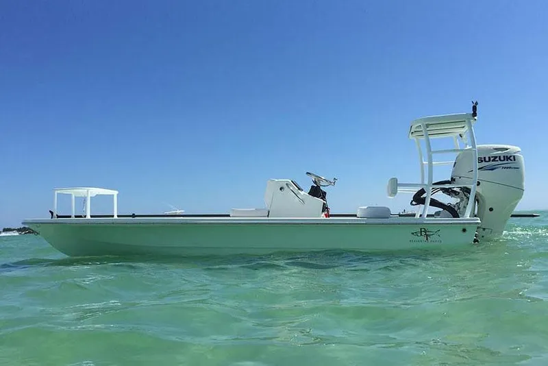 The Image of Manufacturer Provided Image: 2024 Beavertail Skiffs Strike boat on clear water with Suzuki outboard motor. - 8