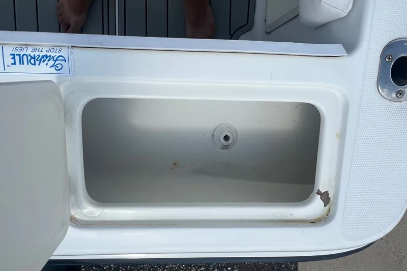 Slide: The Image of Open storage compartment on a 2000 Hydra-Sports 230 Seahorse WA boat. - 10
