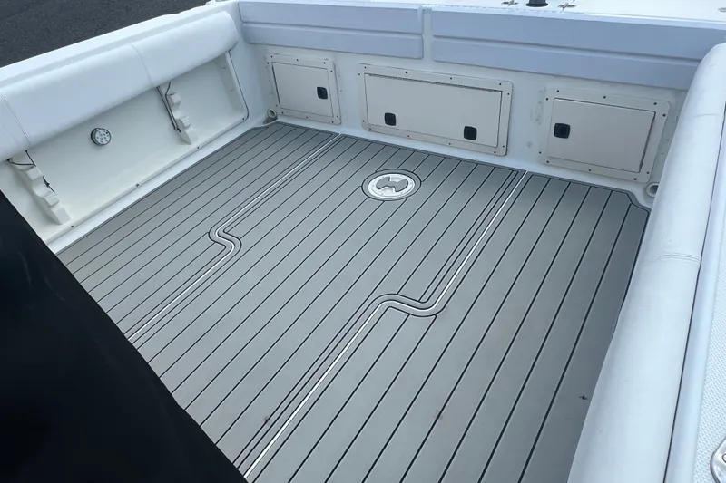 Slide: The Image of 2000 Hydra-Sports 230 Seahorse WA boat deck with sleek, modern design and storage compartments. - 6