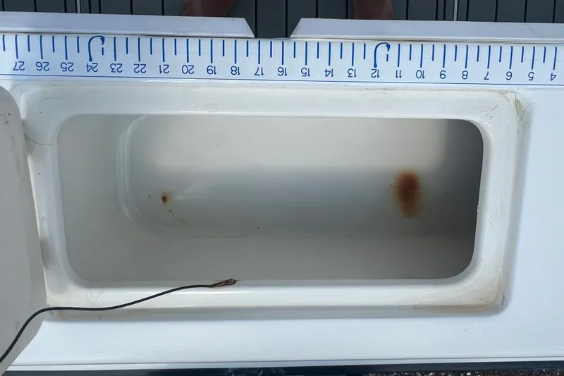 Slide: The Image of Hydra-Sports 230 Seahorse WA 2000 fish box with measuring ruler, showing interior details. - 9