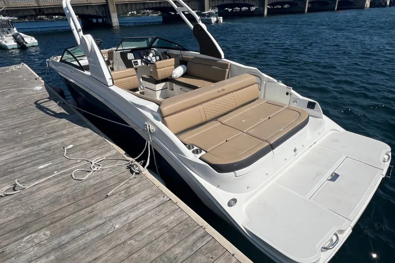 Slide: The Image of 2018 Sea Ray SDX 270 boat docked, featuring spacious seating and sleek design. - 1