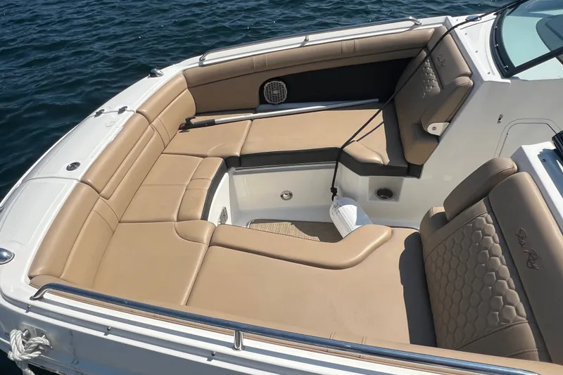 Slide: The Image of Luxurious seating on 2018 Sea Ray SDX 270 boat, featuring tan upholstery and spacious layout. - 2