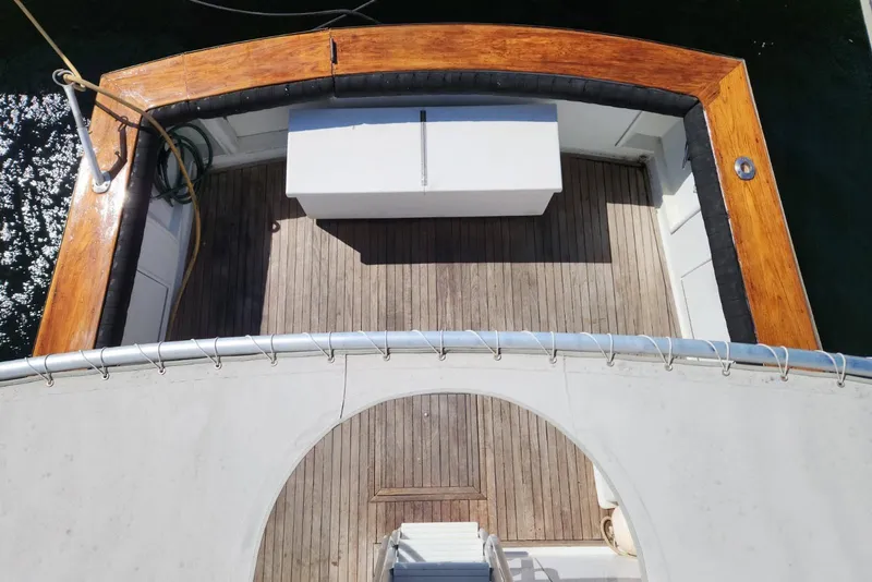 Slide: The Image of Top view of 1988 Ocean Yachts 48 Super Sport deck with wooden finish. - 13