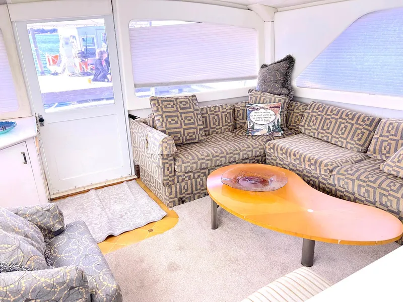 Slide: The Image of 1988 Ocean Yachts 48 Super Sport Convertible interior with patterned seating and modern decor. - 33