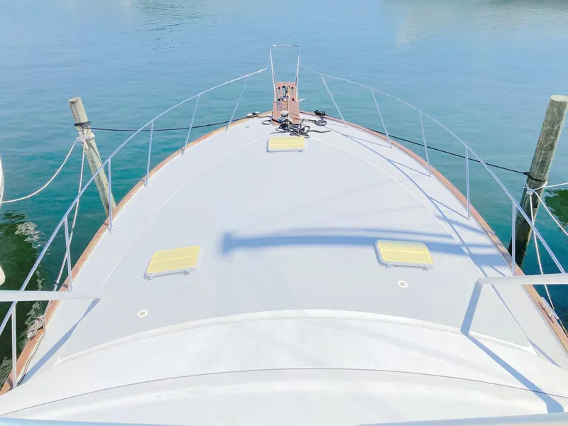 Slide: The Image of 1988 Ocean Yachts 48 Super Sport Convertible yacht deck view on calm water. - 9