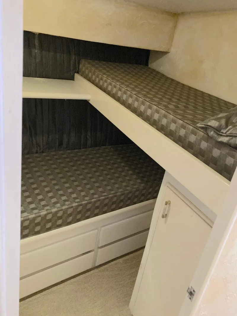 Slide: The Image of Bunk beds in 1988 Ocean Yachts 48 Super Sport Convertible cabin interior. - 49