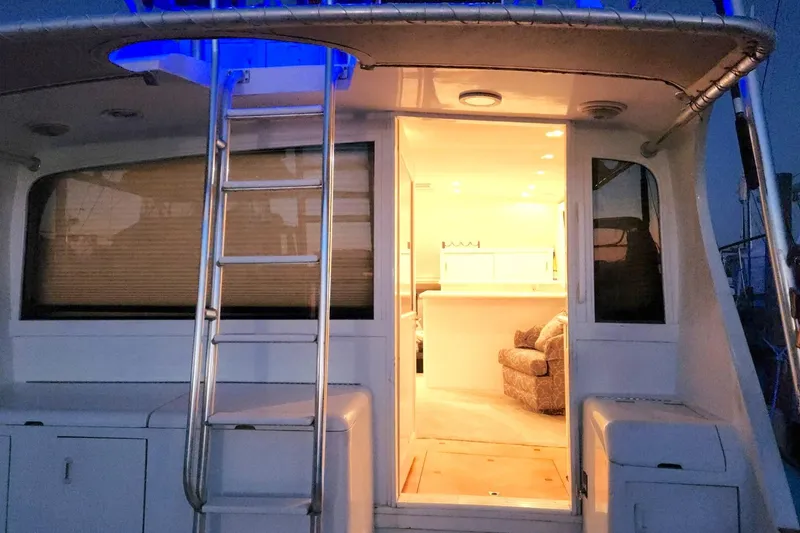 Slide: The Image of 1988 Ocean Yachts 48 Super Sport yacht interior with ladder and illuminated cabin. - 26