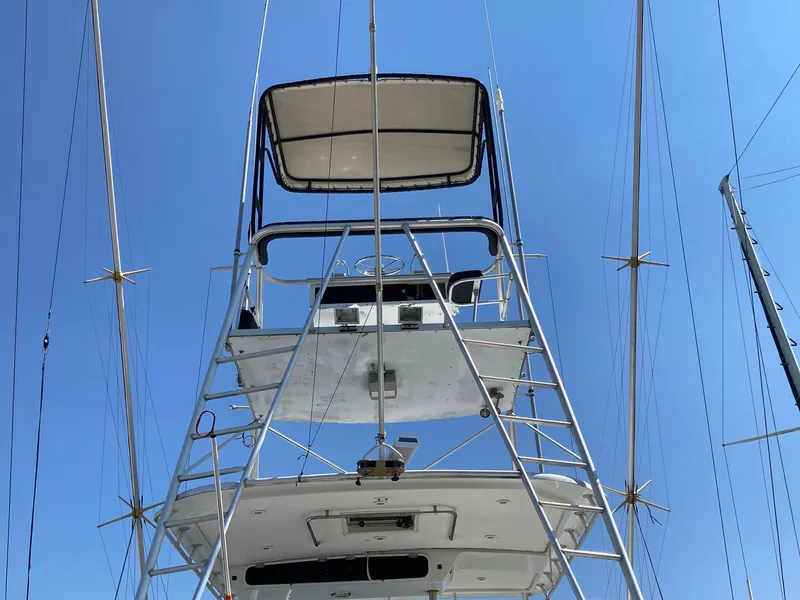 Slide: The Image of 1988 Ocean Yachts 48 Super Sport Convertible, view of tower and bridge against blue sky. - 23
