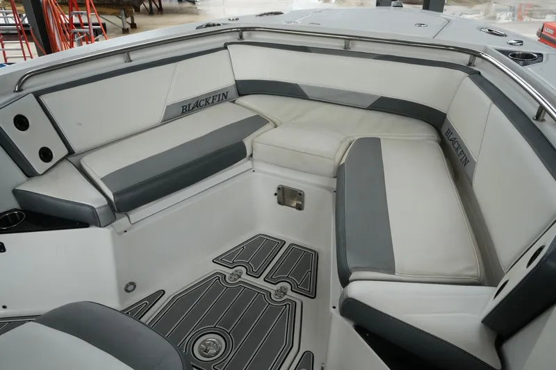 Slide: The Image of 2019 Blackfin 242 CC boat interior with cushioned seating and sleek design. - 19