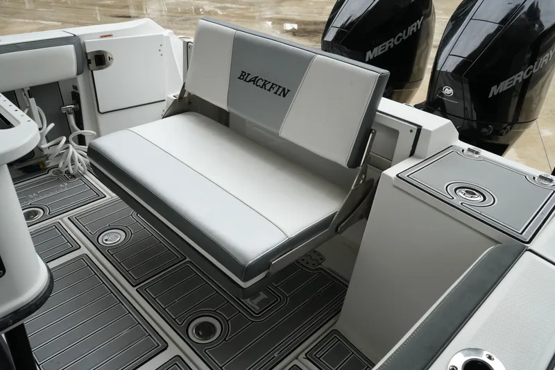 Slide: The Image of 2019 Blackfin 242 CC boat interior with foldable seat and Mercury engines. - 51