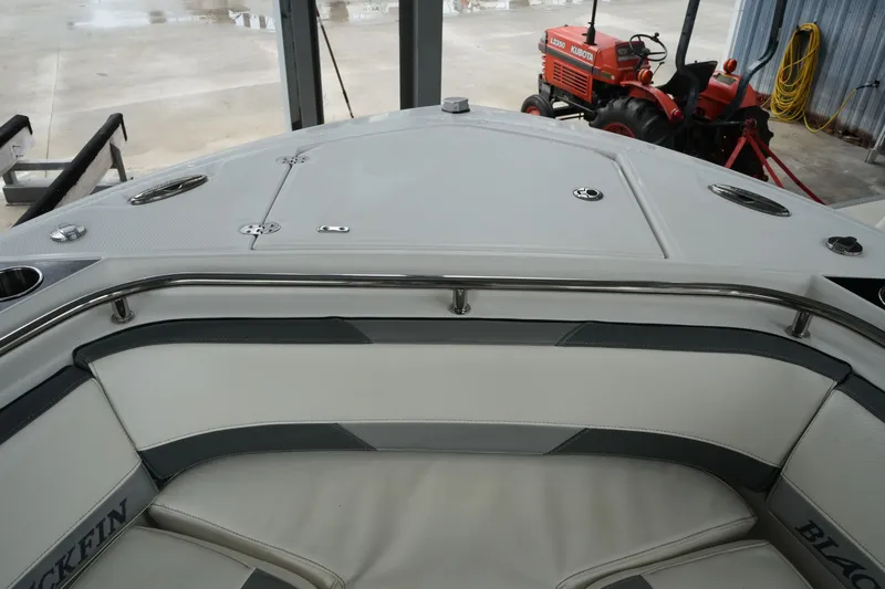 Slide: The Image of 2019 Blackfin 242 CC boat interior with cushioned seating and stainless steel rail. - 40