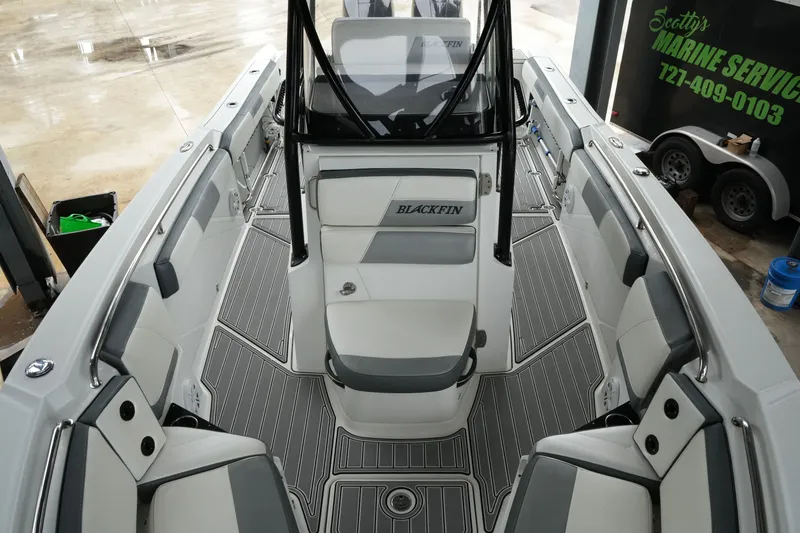 Slide: The Image of 2019 Blackfin 242 CC boat interior with sleek seating and modern design. - 20