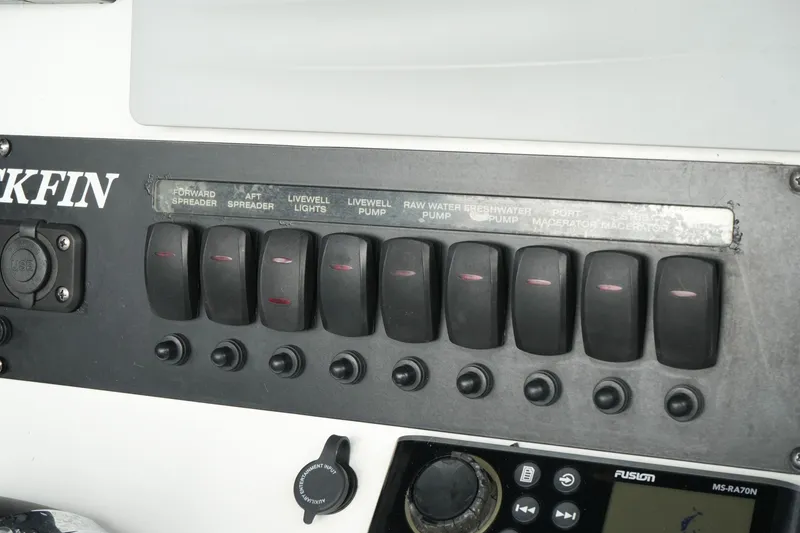 Slide: The Image of Control panel of a 2019 Blackfin 242 CC boat with labeled switches. - 36