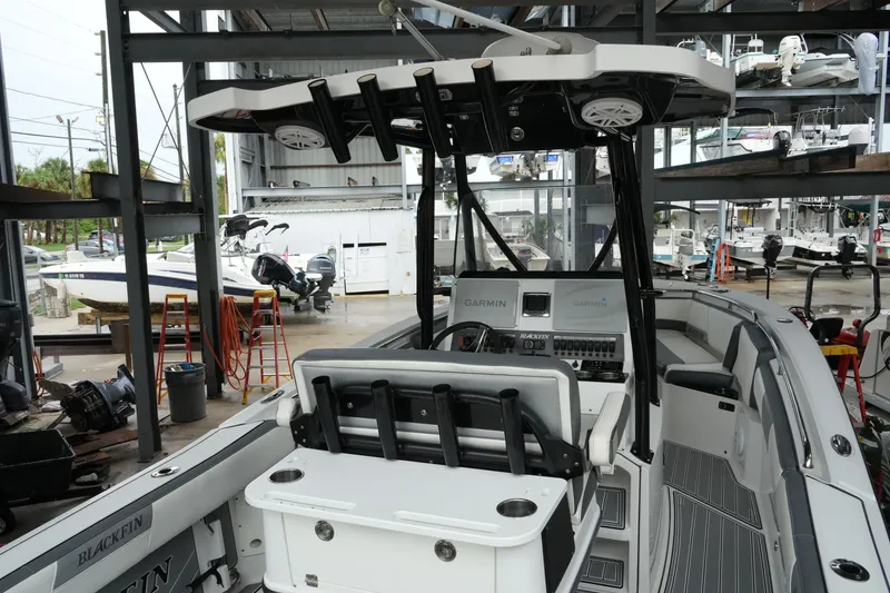 Slide: The Image of 2019 Blackfin 242 CC boat interior with Garmin electronics in a storage facility. - 29