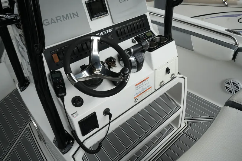 Slide: The Image of 2019 Blackfin 242 CC boat helm with Garmin electronics and steering wheel. - 49