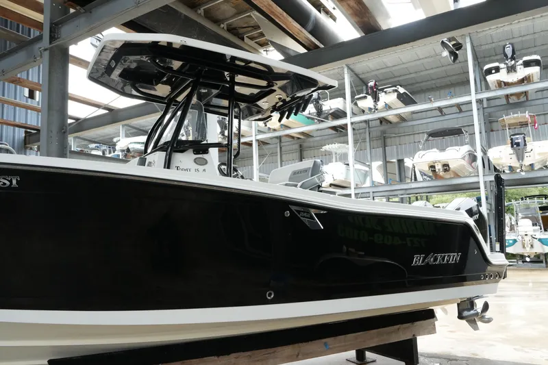 Slide: The Image of 2019 Blackfin 242 CC boat in storage facility, side view. - 28