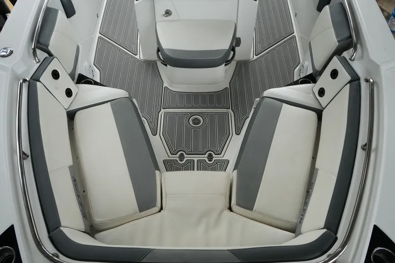 Slide: The Image of 2019 Blackfin 242 CC boat interior with gray and white seating and flooring. - 41