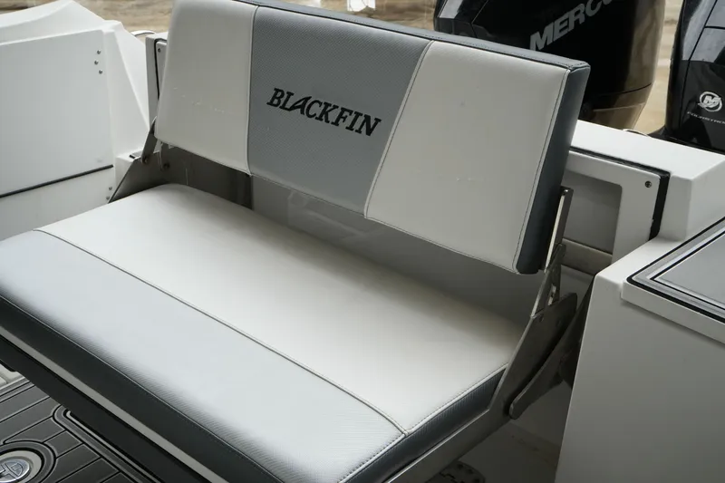 Slide: The Image of 2019 Blackfin 242 CC boat seat with logo, featuring sleek design and comfortable upholstery. - 52