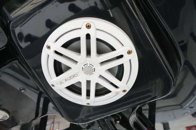 Slide: The Image of White JL Audio speaker on a 2019 Blackfin 242 CC boat. - 16