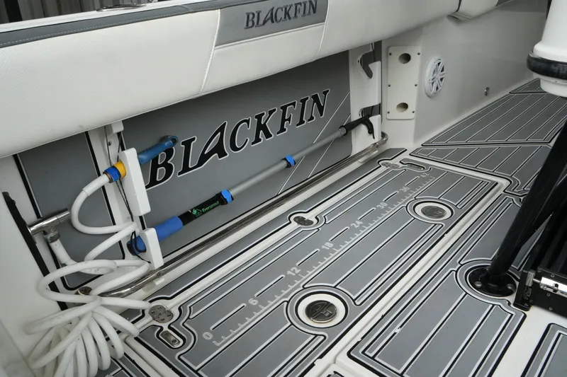 Slide: The Image of 2019 Blackfin 242 CC boat interior with storage and measuring features. - 14