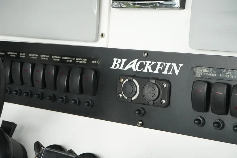 Slide: The Image of Control panel of a 2019 Blackfin 242 CC boat with labeled switches and USB ports. - 37