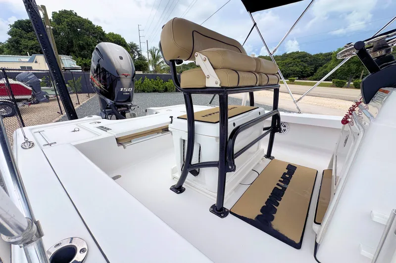 Slide: The Image of 2019 Sportsman Tournament 214 SBX Bay Boat interior with seating and outboard motor. - 15