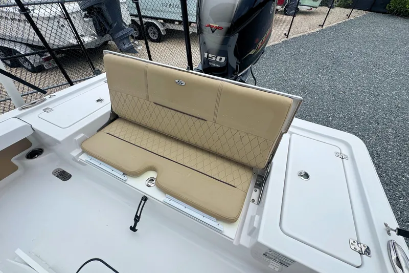 Slide: The Image of 2019 Sportsman Tournament 214 SBX Bay Boat with beige seating and Yamaha 150 engine. - 12
