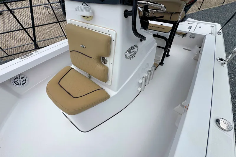 Slide: The Image of 2019 Sportsman Tournament 214 SBX Bay Boat interior with tan seating and console. - 21