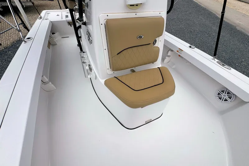 Slide: The Image of 2019 Sportsman Tournament 214 SBX Bay Boat interior with tan seating and white deck. - 22