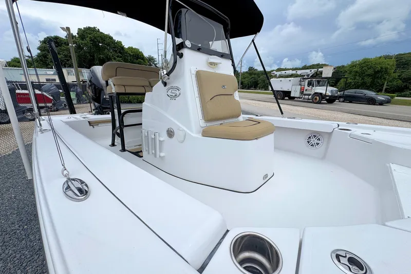 Slide: The Image of 2019 Sportsman Tournament 214 SBX Bay Boat with tan seating and sleek design. - 20