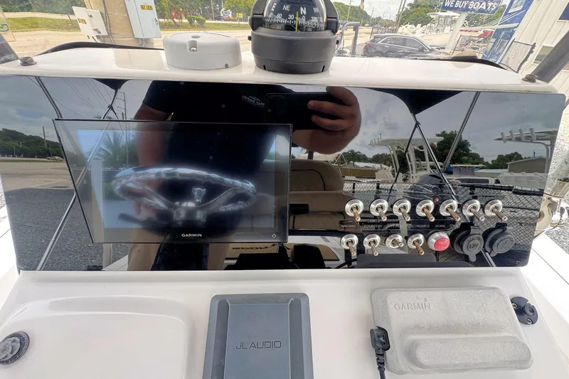 Slide: The Image of Console of a 2019 Sportsman Tournament 214 SBX Bay Boat with Garmin display and controls. - 17