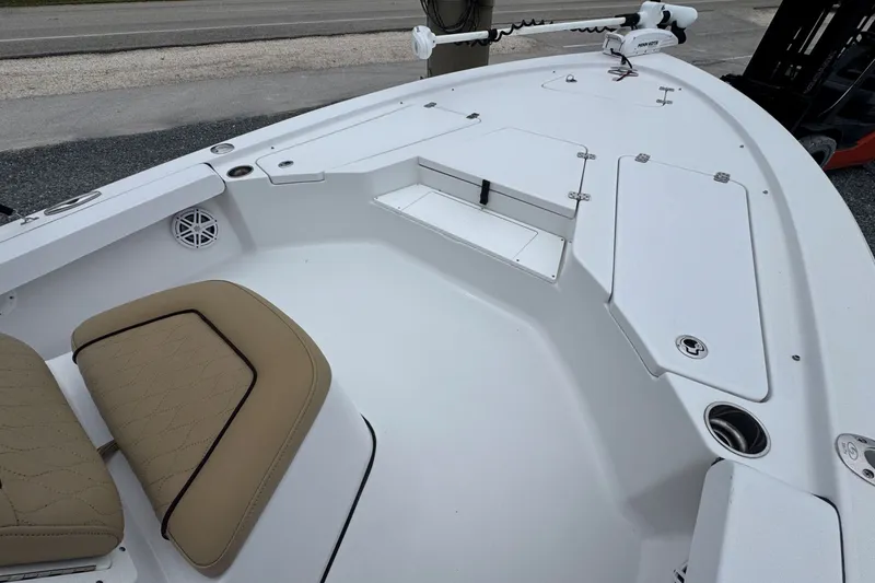 Slide: The Image of 2019 Sportsman Tournament 214 SBX Bay Boat interior with seating and storage compartments. - 18