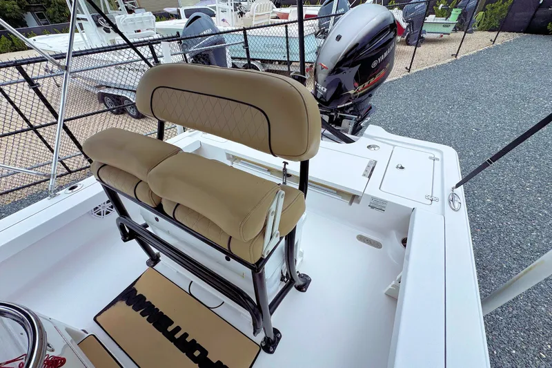 Slide: The Image of 2019 Sportsman Tournament 214 SBX Bay Boat interior with seating and Yamaha outboard motor. - 10
