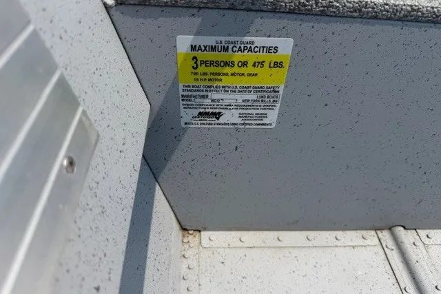 Slide: The Image of Maximum capacity label on 2025 Lund WC-12 boat, indicating 3 persons or 475 lbs. - 4