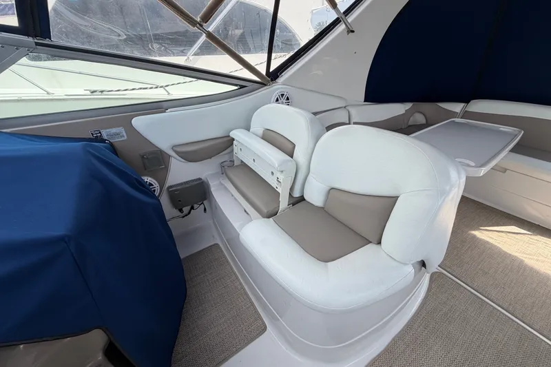 Slide: The Image of Interior seating of 2004 Wellcraft 3700 Martinique boat with white and beige upholstery. - 11