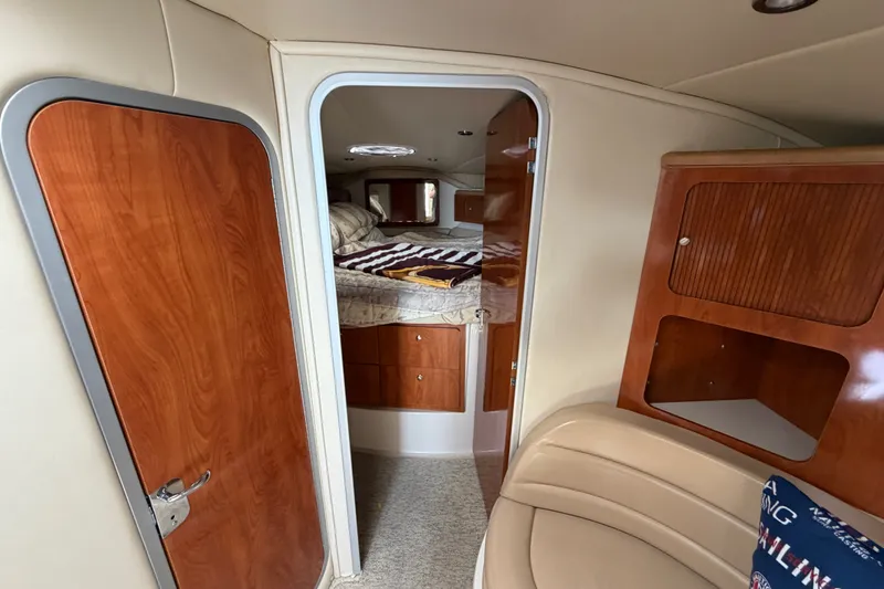 Slide: The Image of Interior of 2004 Wellcraft 3700 Martinique yacht with cozy cabin and wooden finishes. - 21