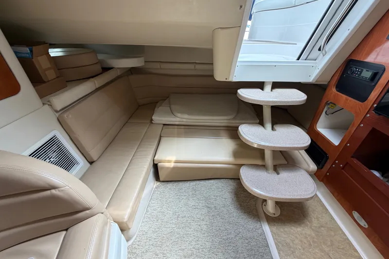 Slide: The Image of Interior of 2004 Wellcraft 3700 Martinique yacht with beige seating and compact staircase. - 25