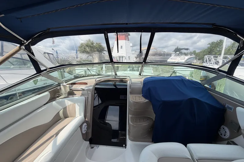Slide: The Image of Interior view of 2004 Wellcraft 3700 Martinique boat with seating and covered dashboard. - 16
