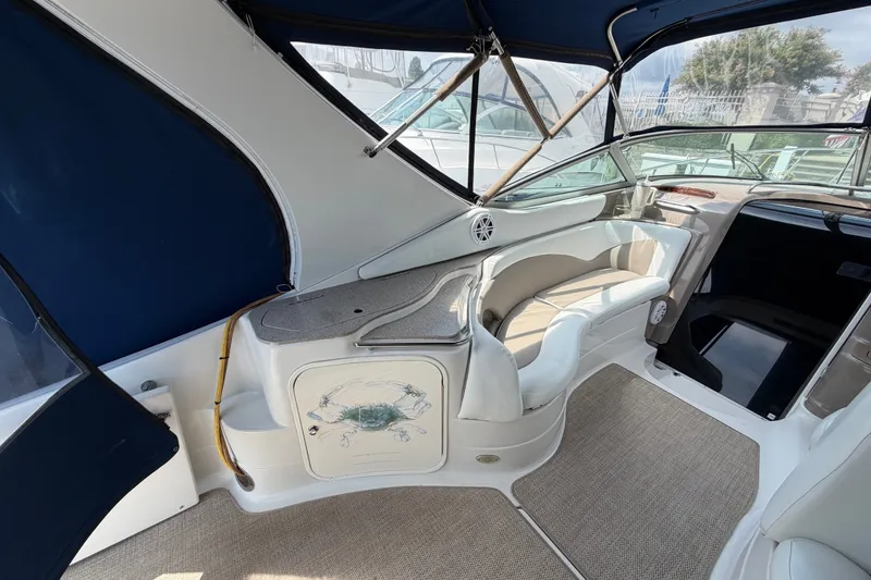 Slide: The Image of 2004 Wellcraft 3700 Martinique boat interior with seating and blue canopy. - 9
