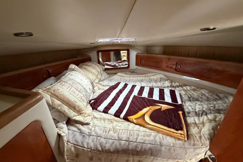 Slide: The Image of Cozy cabin interior of 2004 Wellcraft 3700 Martinique yacht with plush bedding. - 22