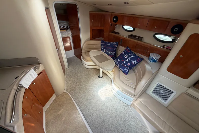 Slide: The Image of Interior of 2004 Wellcraft 3700 Martinique yacht with cozy seating and elegant wood finishes. - 18